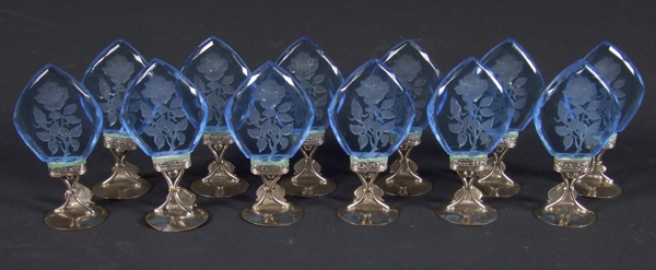 12 Czech glass place card holders, round metal bases support blue Czech glass diamond shaped decoration with intaglio cut roses and leaves